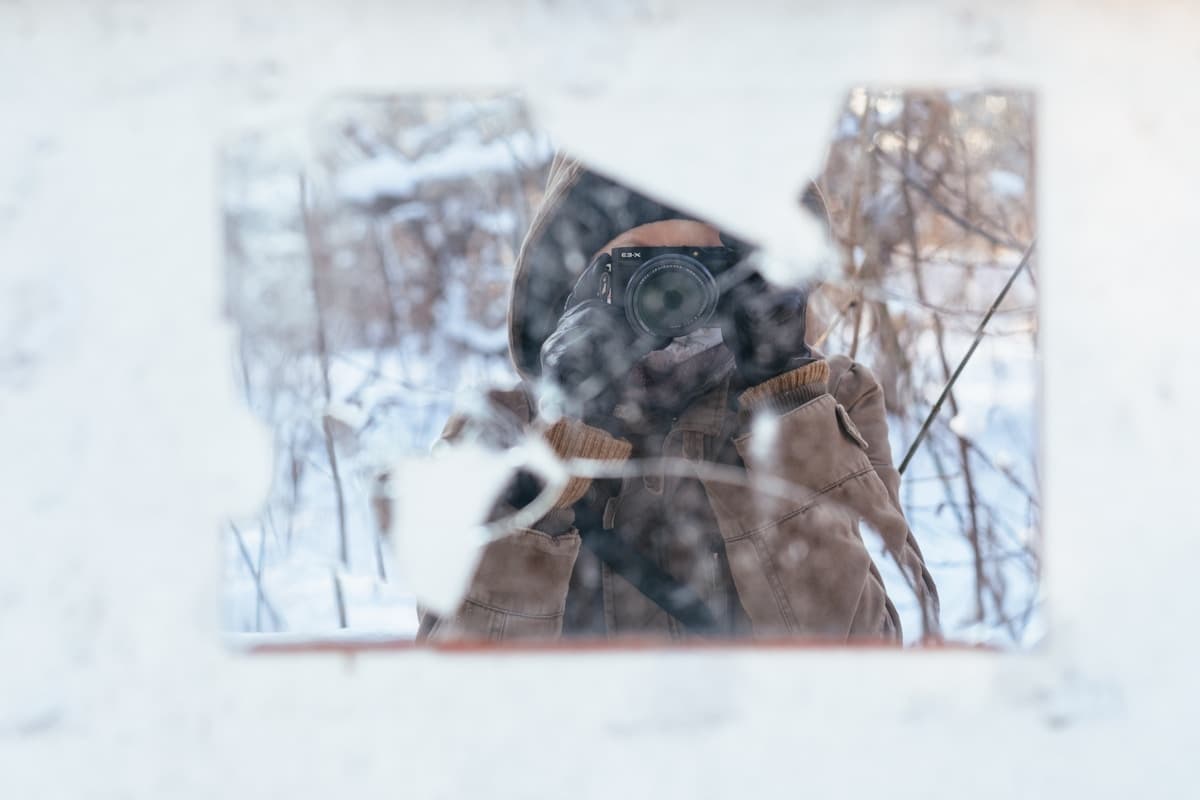 Person sitting quietly and reflecting, representing the process of noticing negative thought patterns